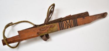 Two Borneo head hunter's wooden sword sheaths, one with crude carving, longest 62cm. PLEASE NOTE ALL