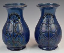 Farnham Art Pottery pair of pedestal vases with incised floral decoration and 'Farnham Blue' to