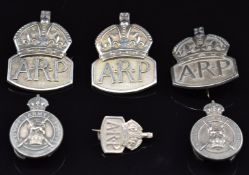 Four hallmarked silver ARP badges together with two Royal Army Reserves hallmarked silver badges