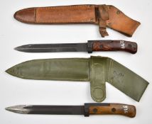 Two Czechoslovakia 1958 pattern bayonets, one with wood grips, 17.5cm fullered blade and plastic
