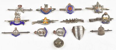 Fourteen silver and enamel, silver and other metal sweetheart brooches including RAMC, Royal