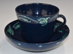Della Robbia art / studio pottery rare cup and saucer with navy glaze and free flowing turquoise