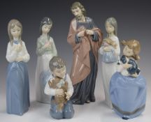 Six Nao figures including children with puppies, tallest 28cm