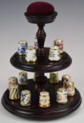 Royal Crown Derby Imari thimble collection on stand, with book including well known patterns /
