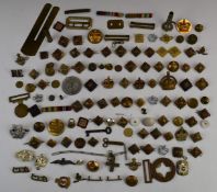 Collection of mainly metal rank insignia, together with some cap badges and buttons