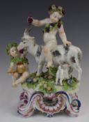 Derby / Chelsea style porcelain figure of cherub / Bacchus riding a goat, height 25cm