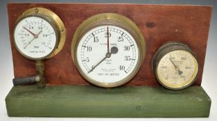 Three steam or similar interest pressure gauges on display stand, comprising War Department