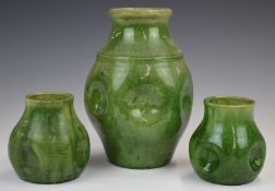 Farnham Art Pottery garniture of dimpled vases, tallest 20cm