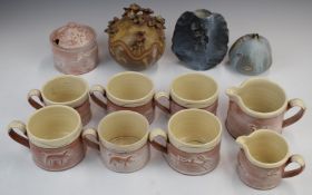 Philip Wood (Nunney, Somerset) studio pottery coffee ware with relief moulded animal decoration,
