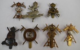 Seven British Army badges comprising 5th Lancers, 25th Dragoons, VI Dragoon Guards, 12th Lancers,