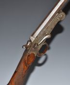 Foreign .410 single barrelled folding poacher's shotgun with chequered grip, side lever and 28