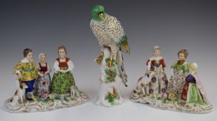 Pair of Derby / Chelsea porcelain figure groups and a parrot, all with gold anchor marks, tallest