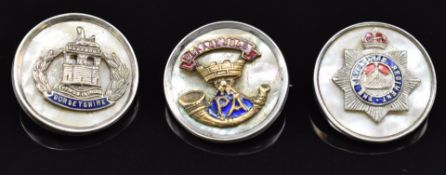 Three mother of pearl and enamel sweetheart brooches for the Somerset Light Infantry, Devonshire