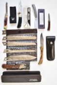 Six various folding knives including a Winchester, Fury Unicorn, Executive Edge, two Whitbys and