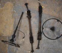 Two Morris Minor steering racks and two steering wheels