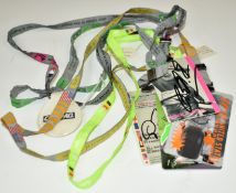 Four signed Formula 1 paddock passes on lanyards comprising Rubens Barrichello 2002 US Grand Prix (