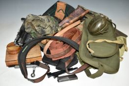 A collection of gun and shooting related accessories including light machine gun slip, rifle