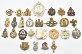 Approximately twenty five British Army and associated badges including United Nations, Physical