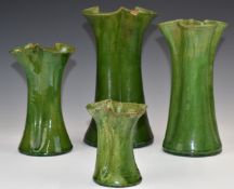 Farnham Art Pottery four graduated flared vases with trefoil necks, tallest 27cm