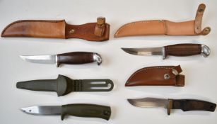 Four hunting knives including Smith & Wesson and Frosts Mora of Sweden, all with sheaths, longest