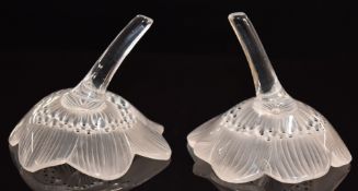 A pair of Lalique glass ring holders in the form of anemone flower heads, each 8.5cm tall.