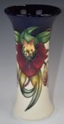 Moorcroft flared vase decorated in the Anna Lily pattern, H20cm