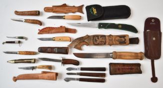 Nine various hunting / skinning knives all with sheaths, longest blade 14cm, together with three