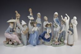 Thirteen Lladro, Nao and Royal Doulton figures including Saturday's Child, Lady with Parasol,