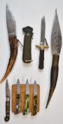 Seven folding knives of various styles including three with decorated blades and three boxed with