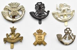 Six British Army Light Infantry badges including 1st Volunteer Battalion Duke of Cornwall's,