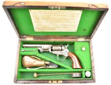 Colt 1849 .31 single-action pocket revolver with shaped wooden grips, silver plated trigger guard