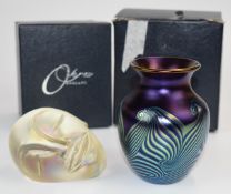 Two pieces of Okra iridescent glass comprising a vase with pulled feather decoration signed to