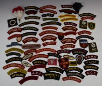Approximately seventy Army cloth shoulder titles / badges, including RMA Sandhurst, Irish Guards,