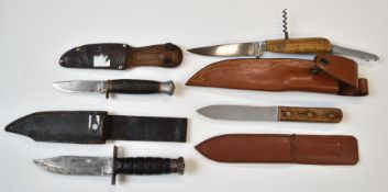 Four hunting knives including a J Russell & Co, Green River Works USA, longest blade 12.5cm, all