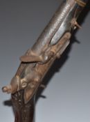 Eastern flintlock jezail with East India Trading Company lion impressed to the lock, carved