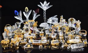 Over 60 Swarovski Crystal Memories and similar clear glass and gilt metal ornaments including