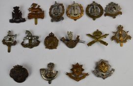 Sixteen British Army badges including the King's Liverpool Regiment, King's Shropshire Light