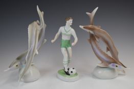 Three Hollohaza figures comprising two pairs of fish and a footballer, tallest 23cm