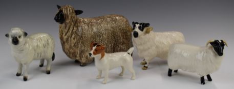 Four Beswick sheep and a Jack Russell, tallest 11cm