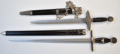 Two replica Nazi daggers, longest blade 43cm, both with sheaths. PLEASE NOTE ALL BLADED ITEMS ARE