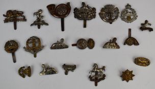 Small collection of British Army cap badges including Middlesex Regiment, Gloucestershire