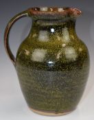 Winchcombe Pottery signed jug with indistinct P / R or B mark, H20cm