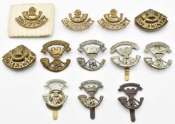 Twelve British Army Light Infantry badges for the Somerset Light Infantry, two with G R Gaunt London
