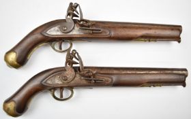 A pair of flintlock pistols each with lock stamped 'Tower' and with crown over 'GR' cypher, line