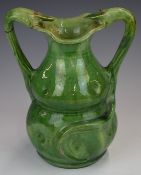 Farnham Art Pottery pedestal vase with dimpled decoration and twin serpent handles, height 21.5cm