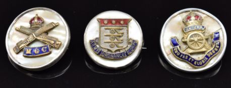 Three mother of pearl and enamel sweetheart brooches for the Royal Artillery, Machine Gun Corps