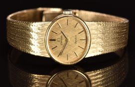 Omega 9ct gold ladies wristwatch ref. 8329 with black hands, two-tone baton hour markers, gold