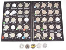 Thirty-three collectable 50p coins in the 1997-2019 folder (seven missing), together with five