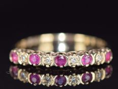 A 9ct gold ring set with rubies and diamonds, 1.2g, size J