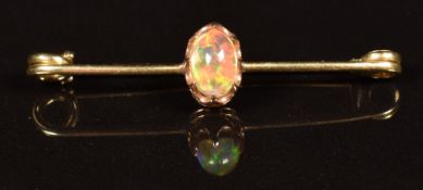 A 9ct gold brooch set with an opal cabochon, 1.8g
